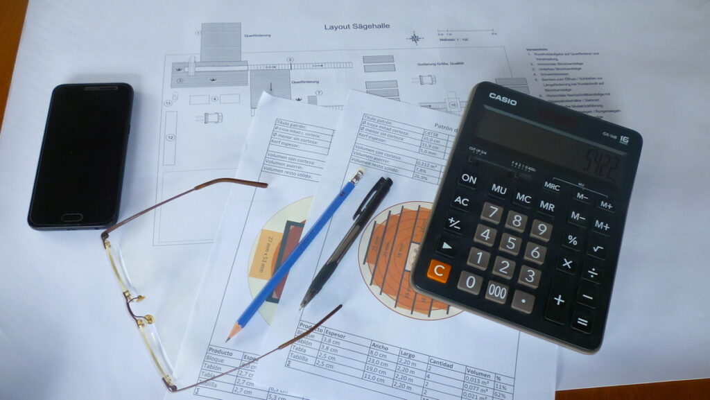 sawmill planning documents on a desk