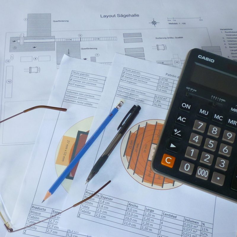 sawmill planning documents on a desk